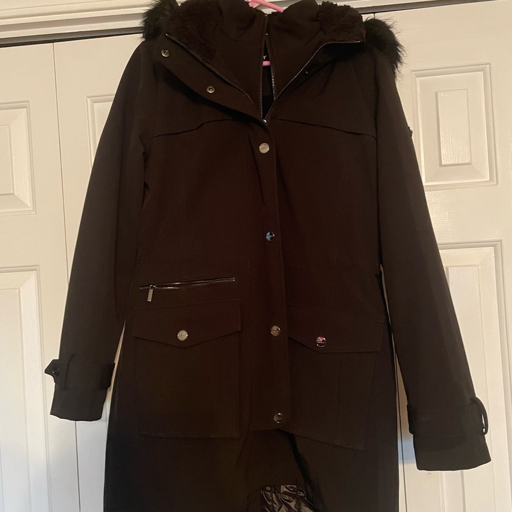 DKNY long black coat with black fur hood. Zipper pocket in the front